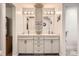 Modern bathroom with granite countertops, dual sinks, and designer fixtures at 2473 S Carr Ct, Lakewood, CO 80227