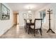 Elegant dining room with wood floors, table, and chairs, perfect for Gathering meals and entertaining at 2473 S Carr Ct, Lakewood, CO 80227