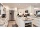 Spacious kitchen with stainless steel appliances, granite countertops, and center island at 2473 S Carr Ct, Lakewood, CO 80227