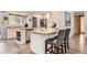 Modern kitchen with granite countertops, stainless steel appliances, and breakfast bar at 2473 S Carr Ct, Lakewood, CO 80227