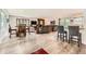 Bright, open-concept living room with modern flooring and a stone fireplace at 2473 S Carr Ct, Lakewood, CO 80227