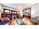 Elegant living room with hardwood floors, built-in shelving, and stained glass accents at 425 N Pennsylvania St, Denver, CO 80203