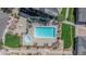 Aerial view featuring community pool and spa surrounded by green spaces at 15700 E Jamison Dr # 305, Englewood, CO 80112