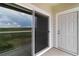 Private balcony showing sliding glass door to unit and exterior door at 15700 E Jamison Dr # 305, Englewood, CO 80112