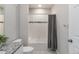 Bathroom with tub-shower, tiled surround, decorative accent tiles and shower curtain at 15700 E Jamison Dr # 305, Englewood, CO 80112