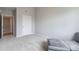 Spacious bedroom with new neutral carpet, and adjacent open doorway to other rooms at 15700 E Jamison Dr # 305, Englewood, CO 80112