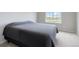Bedroom featuring soft carpet flooring and natural light from the window at 15700 E Jamison Dr # 305, Englewood, CO 80112