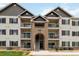 Charming condo complex with balconies, brick accents, and well-maintained landscaping at 15700 E Jamison Dr # 305, Englewood, CO 80112