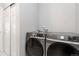 Laundry area featuring modern, front-loading Samsung washer and dryer at 15700 E Jamison Dr # 305, Englewood, CO 80112