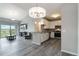 Open living space features a modern kitchen, spacious dining area, and stylish lighting at 15700 E Jamison Dr # 305, Englewood, CO 80112