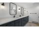 Bathroom with a granite countertop, double sinks, and modern fixtures at 2711 S Fenton St, Denver, CO 80227
