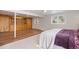 Cozy bedroom featuring hardwood floors, built-in cabinets, and natural light from two windows at 2711 S Fenton St, Denver, CO 80227