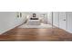 Bright bedroom featuring a large bed, wooden floor, stylish rug, and windows at 2711 S Fenton St, Denver, CO 80227
