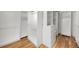 Large walk-in closet boasts white shelving units and drawers with gold hardware at 2711 S Fenton St, Denver, CO 80227