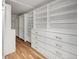 Spacious walk-in closet with custom shelving and drawers, offering ample storage at 2711 S Fenton St, Denver, CO 80227