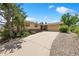 Inviting ranch-style home with a brick and siding exterior, featuring a spacious driveway and a well-maintained front yard at 2711 S Fenton St, Denver, CO 80227