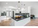 Bright kitchen featuring white cabinets, dark countertops, stainless steel appliances, and a central island at 2711 S Fenton St, Denver, CO 80227