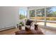 Cozy living room space with natural light and beautiful backyard views at 2711 S Fenton St, Denver, CO 80227
