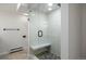 Glass enclosed shower with a built-in seat at 2711 S Fenton St, Denver, CO 80227