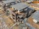 Aerial view of modern townhomes featuring multiple decks and landscaped grounds at 3207 W 25Th Ave, Denver, CO 80211