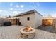 Outdoor living space with a fire pit and fenced backyard at 3207 W 25Th Ave, Denver, CO 80211