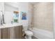 Contemporary bathroom featuring a soaking tub, tiled shower, and modern vanity at 3207 W 25Th Ave, Denver, CO 80211