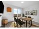 Modern dining room with sliding glass doors to a balcony, neutral color scheme, and contemporary decor at 3207 W 25Th Ave, Denver, CO 80211