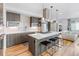 Modern kitchen with white countertop island and stainless steel appliances at 3207 W 25Th Ave, Denver, CO 80211