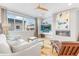 Bright living room featuring a fireplace, large windows, and modern furniture at 3207 W 25Th Ave, Denver, CO 80211