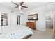 Light-filled main bedroom featuring a large closet and bathroom access at 3207 W 25Th Ave, Denver, CO 80211