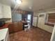 Kitchen with ample cabinetry and a view into the living room at 701 S Pecos St, Denver, CO 80223