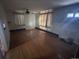 Bright living room featuring hardwood floors and a ceiling fan at 701 S Pecos St, Denver, CO 80223