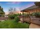 Inviting covered deck in a lush backyard setting, perfect for outdoor entertaining at 92 S Devinney St, Golden, CO 80401