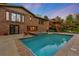 Stunning backyard with a sparkling pool, hot tub, and a spacious deck perfect for outdoor entertaining at 92 S Devinney St, Golden, CO 80401