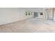 The basement offers a large, open area with sliding glass doors and windows for natural light at 92 S Devinney St, Golden, CO 80401