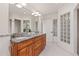 Elegant bathroom featuring dual sinks with granite countertops, stylish lighting, and modern fixtures at 92 S Devinney St, Golden, CO 80401