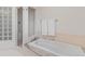 Bathroom with tub and glass block shower at 92 S Devinney St, Golden, CO 80401