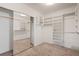 Walk-in closet with ample shelving and mirrored doors, providing plenty of storage space at 92 S Devinney St, Golden, CO 80401