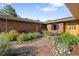 Charming brick home showcases lush flowerbeds and a stone walkway at 92 S Devinney St, Golden, CO 80401