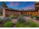 Charming brick home showcases lush flowerbeds and a stone walkway at 92 S Devinney St, Golden, CO 80401