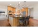 Gourmet kitchen featuring granite countertops, stainless steel appliances, and a breakfast bar at 92 S Devinney St, Golden, CO 80401