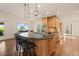 Gourmet kitchen featuring granite countertops, stainless steel appliances, and a breakfast bar at 92 S Devinney St, Golden, CO 80401