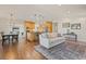 Open concept living room and kitchen offers modern design, hardwood floors, and natural light at 92 S Devinney St, Golden, CO 80401