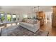 Open concept living room and kitchen offers modern design, hardwood floors, and natural light at 92 S Devinney St, Golden, CO 80401