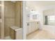 Bright bathroom featuring a tiled shower and double sink vanity at 8525 E 149Th Dr, Thornton, CO 80602