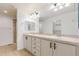 Bright bathroom features a double sink vanity with modern fixtures and tile floors at 8525 E 149Th Dr, Thornton, CO 80602