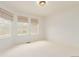 Bright bedroom with three large windows and neutral carpet at 8525 E 149Th Dr, Thornton, CO 80602