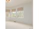 Bright bedroom with three large windows at 8525 E 149Th Dr, Thornton, CO 80602