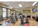 Fully equipped fitness center with cardio machines, weights, and plenty of natural light at 8525 E 149Th Dr, Thornton, CO 80602