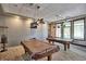 Relax in this community game room featuring billiard tables and overhead pendant lighting at 8525 E 149Th Dr, Thornton, CO 80602